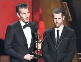  ??  ?? Creator-showrunner­s David Benioff (left, and D.B. Weiss accept the award for outstandin­g writing for a drama series for ‘Game Of Thrones’ at the 67th Primetime Emmy Awards in Los Angeles.