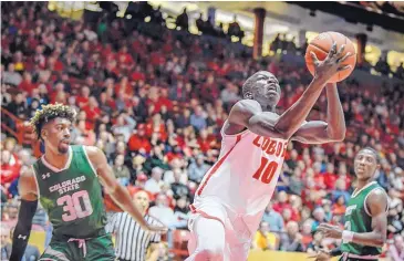  ?? ROBERTO E. ROSALES/JOURNAL FILE ?? Lobo men’s basketball player Makuach Maluach, like many UNM foreign-born athletes, will have to overcome some major travel hurdles just to return to the United States to continue their careers. Maluach is Australian.