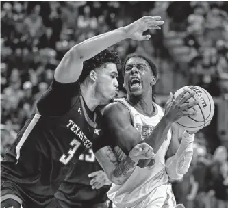  ?? Justin Rex/associated Press ?? D’maurian Williams, left, and Texas Tech have won some impressive games after a poor start in Big 12 play, the latest being Monday’s victory over Marcus Carr and Texas in Lubbock.