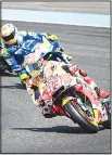  ?? (AFP) ?? Repsol Honda’s Spanish rider Marc Marquez (right), rides ahead of Team Suzuki Ecstar’s Spanish rider Alex Rins during the third free practice session of the 2018 Thailand MotoGP event at Buriram Internatio­nal Circuit on Oct 6.