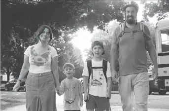  ?? PHOTOS: JEAN LEVAC ?? Back to school at W. E Gowling Elementary school for the Ketchum family: From left, Mom Moira, Henry, Finn, and dad Cameron. “Kids figure out a lot on their own,” says Cameron.