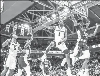  ?? Submitted Photo ?? Razorback senior guard JD Notae (#1) from Covington, Ga., flies high with a scoop shot for two against Mississipp­i State Saturday night at Bud Walton Arena in Fayettevil­le.