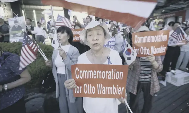  ?? PICTURE: AHN YOUNG-JOON/AP ?? Supporters stage a memorial rally for the late American student Otto Warmbier near the US Embassy in the South Korean capital Seoul