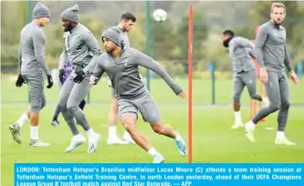  ??  ?? LONDON: Tottenham Hotspur’s Brazilian midfielder Lucas Moura (C) attends a team training session at Tottenham Hotspur’s Enfield Training Centre, in north London yesterday, ahead of their UEFA Champions League Group B football match against Red Star Belgrade. — AFP