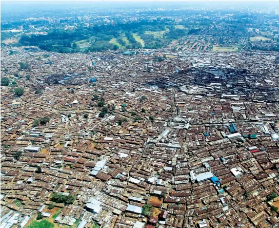  ??  ?? MAP QUEST: Social service agencies are using innovative cartograph­y to help bring aid to those in need in Kibera, a slum with 170,000 residents in Nairobi.