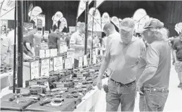  ?? ORLANDO SENTINEL FILE PHOTO ?? Private firearms sales at gun shows don’t require a criminal background check for the buyer. Senate President Bill Galvano wants to change that.