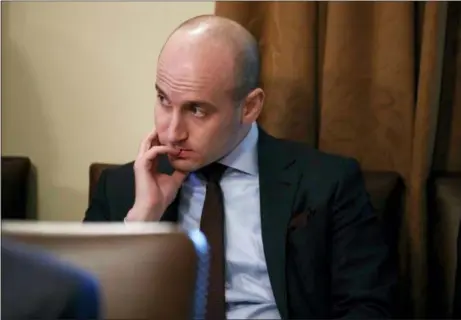  ?? EVAN VUCCI — THE ASSOCIATED PRESS FILE ?? White House senior adviser Stephen Miller listens as President Donald Trump speaks during a cabinet meeting at the White House in Washington. Miller indicated Feb. 17 on “Fox News Sunday” that Trump is prepared to issue the first veto of his term if Congress votes to disapprove of his declaratio­n of a national emergency along the U.S.-Mexico border.