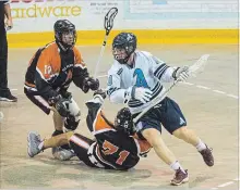  ?? JULIE JOCSAK THE ST. CATHARINES STANDARD ?? St. Catharines’ Liam Ham, right, works toward the Six Nations goaltender. It’s been a long time since the A’s have had a playoff win against Six Nations. The A’s won 8-7.