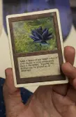  ??  ?? Deceder shows off a Black Lotus card from Magic: The Gathering.