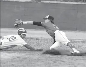  ?? RICK PECK/SPECIAL TO MCDONALD COUNTY PRESS ?? McDonald County shortstop Boston Dowd stretches for a throw as Carthage’s Colby Cox dives back to second base on a pick-off attempt during the Mustangs’ 6-1 win on March 28 in Carthage.