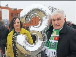  ??  ?? Elizabeth Kelly and her brother Thomas Kinghorn outside Celtic Park with their balloon tribute to Tommy Picture: Colin Mearns