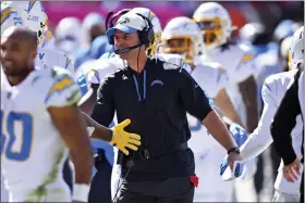  ?? DAVID RICHARD — THE ASSOCIATED PRESS ?? Los Angeles Chargers head coach Brandon Staley celebrates with the team after the they scored a touchdown against the Cleveland Browns during the first half of an NFL football game, Sunday, Oct. 9, 2022, in Cleveland.