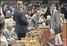  ?? AFP ?? Nepal’s former PM KP Oli Sharma (right) and Maoist chairman Pushpa Kamal Dahal ‘Prachanda’ meet in Parliament.