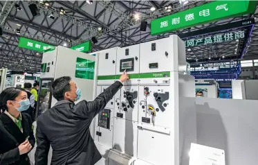  ??  ?? Equipment made by Schneider Electric on display at the CDCE Internatio­nal Data Center Exhibition on December 3, 2020, in Shanghai.