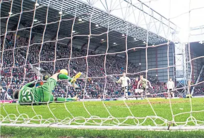  ?? Photograph: SNS ?? Hearts’ Jamie Walker takes a penalty only to have it saved by Owain Fon Williams