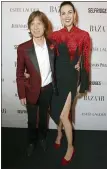  ??  ?? Mick Jagger and then-girlfriend, designer L’Wren Scott, in 2013.