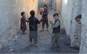  ?? RAHMAT GUL/AP ?? Internally displaced boys play with a ball outside their temporary home in the city of Kabul, Afghanista­n, on Wednesday.