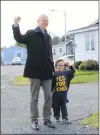  ?? DAVID MAHER/THE TELEGRAM ?? Ches Crosbie and his youngest supporter show their enthusiasm Wednesday as the byelection vote draws near.