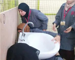  ??  ?? Trainee plumbers fix a sink in a program run by German Developmen­t Agency GIZ.
(GIZ photo)