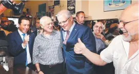  ??  ?? Pellegrini­s co-owner Nino Pangrazio with Victorian Opposition Leader Matthew Guy and PM Scott Morrison.