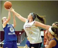  ?? Special to the Westside Eagle Observer/DESI MEEK ?? Decatur’s Sammie Skaggs tries to put a shot over a Lady Warrior defender during the fifth quarter scrimmage game between Decatur and Life Way in Centerton June 21.