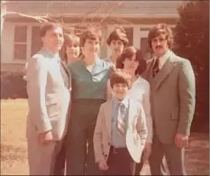  ?? Provided ?? The Rev. Francis P. Melfe, who left the priesthood the year before, poses with Edith Thomas and their five children, including his biological son, at Easter 1980.