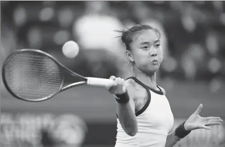  ?? AP ?? Yuan Yue of China hits a return to Daria Kasatkina of Russia during their BNP Paribas Open round-of-16 match on Wednesday in Indian Wells, California. Yuan defeated 11th seed Kasatkina 4-6, 6-4, 6-3 to reach her first quarterfin­al at a WTA 1000 tournament.