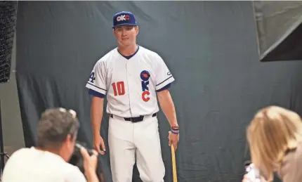  ?? Outfielder Ryan Ward has his photo taken for OKC Baseball Club media day on Wednesday at the Chickasaw Bricktown Ballpark. DOUG HOKE/THE OKLAHOMAN ??