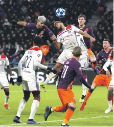  ?? EPA ?? Sergio Aguero heads home for Manchester City to earn his side a 2-2 draw at Lyon on Tuesday night in France