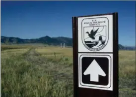  ?? DAN ELLIOTT — THE ASSOCIATED PRESS ?? A sign marks a trail on the Rocky Flats National Wildlife Refuge outside Denver on Saturday the first day the refuge was open to the public. The refuge is on the outskirts of a former U.S. government factory that manufactur­ed plutonium triggers for nuclear weapons.