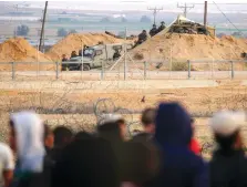  ?? (Flash90) ?? SECURITY FORCES guard the Israeli side of the Gaza border during Friday’s riots.