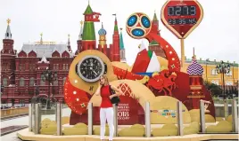  ??  ?? Nearly there...the World Cup countdown clock in front of Red Square and the Kremlin in Moscow