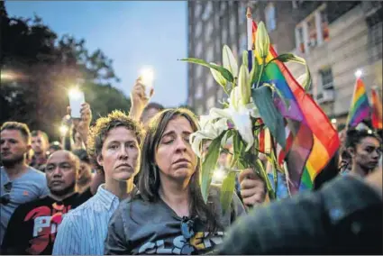  ??  ?? Too many tears: A vigil in New York for the victims killed at the Pulse nightclub in Orlando, Florida, last Saturday, and Quinton Taylor (left), who survived the Sizzlers massacre in Cape Town in 2003.