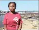  ??  ?? Local teenager Buntu Sibiya on the shores of one of South Africa’s premier tourist attraction­s, the iSimangali­so Wetland Park World heritage site.