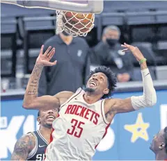  ?? AFP ?? The Rockets’ Christian Wood dunks against the Spurs in San Antonio.