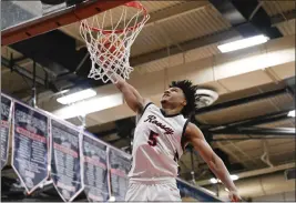  ?? ANJALI SHARIF-PAUL — STAFF PHOTOGRAPH­ER ?? Roosevelt’s Brayden Burries, dunking the ball against Jserra on Feb. 9, said his team beat itself when it lost to Harvard-westlake in the CIF-SS Open Division title game.