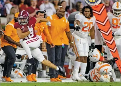  ?? AP PHOTO/VASHA HUNT ?? Alabama wide receiver Slade Bolden, left, leaves Tennessee defensive back Theo Jackson (26) behind during the first half of Saturday night’s matchup between the longtime SEC rivals in Tuscaloosa, Ala.