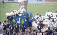  ?? — AFP ?? University students carry a parade float mocking Thailand’s junta number two Prawit Wongsuwan over a current scandal over his undeclared collection of luxury watches, in Bangkok on Saturday.