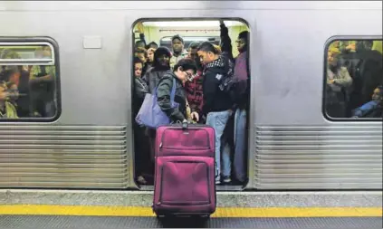  ??  ?? Liberating experience: It takes courage for a lone African womxn to take the undergroun­d metro in São Paulo. Photo: Nacho Doce/Reuters