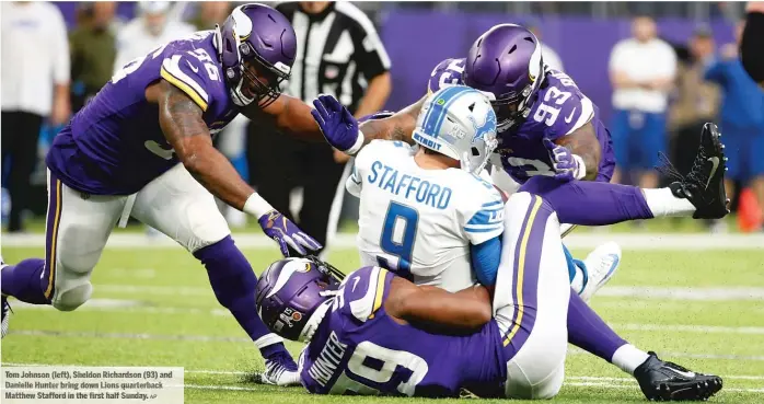  ?? AP ?? Tom Johnson (left) ,S heldon Richardson (93) and Danielle Hunter bring down Lions quarterbac­k Matthew Staff ordi nt he first hal f Sunday.