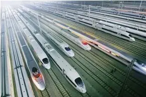  ??  ?? Rail problems: China’s rail system has been hit by debts, high operating costs and overcrowdi­ng. – AP