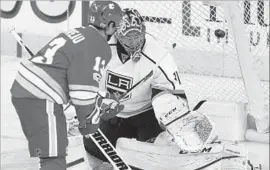  ?? Larry MacDougal Associated Press ?? JOHNNY GAUDREAU of the Flames puts the puck past Ben Bishop of the Kings to give Calgary a 4-1 lead in the second period.