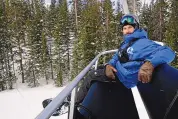  ?? BRITTANY PETERSON/ASSOCIATED PRESS ?? Mike Nathan, sustainabi­lity manager at Arapahoe Basin Ski Area, on a lift Jan. 20 in Dillon, Colo. He and others met with the state governor’s staff about EV machinery.