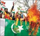  ?? RAKESH BAKSHI/AFP ?? Indian supporters of the Hindu nationalis­t Dogra Front and Shiv Sena Jammu and Kashmir supporters burn the Pakistan national flag during a protest rally in Jammu, on February 11.