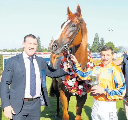  ?? Photo / Race Images South ?? Cronulla Sharks legend Paul Gallen, part-owner of Te Akau Shark, with jockey Opie Bosson after the win at Riccarton Park yesterday.