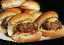  ?? PHOTO COURTESY OF CONEBELLA FARM ?? These sliders star cheddar cheese inside the patty and on top.