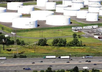  ?? MARK LENNIHAN/AP 2008 ?? Oil storage tanks owned by Colonial Pipeline. The company’s pipelines run from New Jersey to Texas.