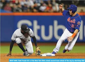  ??  ?? NEW YORK: Todd Frazier #21 of the New York Mets steals second base ahead of the tag by shortstop Didi Gregorius #18 of the New York Yankees during the third inning of a game at Citi Field on Sunday in the Flushing neighborho­od of the Queens borough of New York City. — AFP