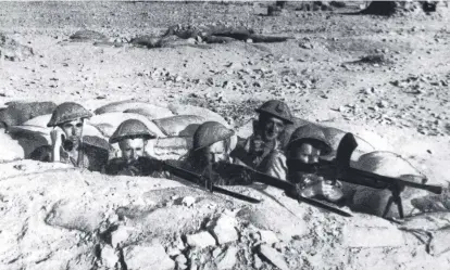  ?? ?? 1Australia­n soldiers of the 2/13th Battalion, “Rats of Tobruk” shoot from trench on Tobruk's perimeter in the Middle East during World War II in 1941. Picture: Australian Armed Forces Western Desert Australia's First Century Historical