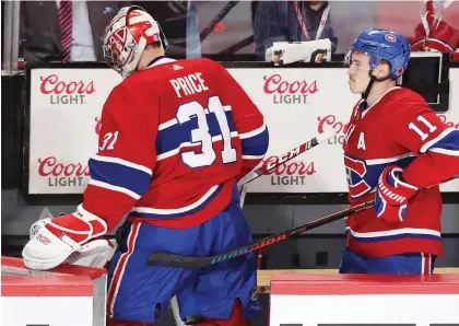  ?? PIERRE OBENDRaUF ?? Canadiens goalie Carey Price leaves the ice with Brendan Gallagher after Thursday night’s overtime loss to the Buffalo Sabres. Price now has a 3.07 goals-against average and an .892 save percentage.